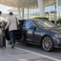 Chauffeur Assists Traveler at Airport Curb 90x90